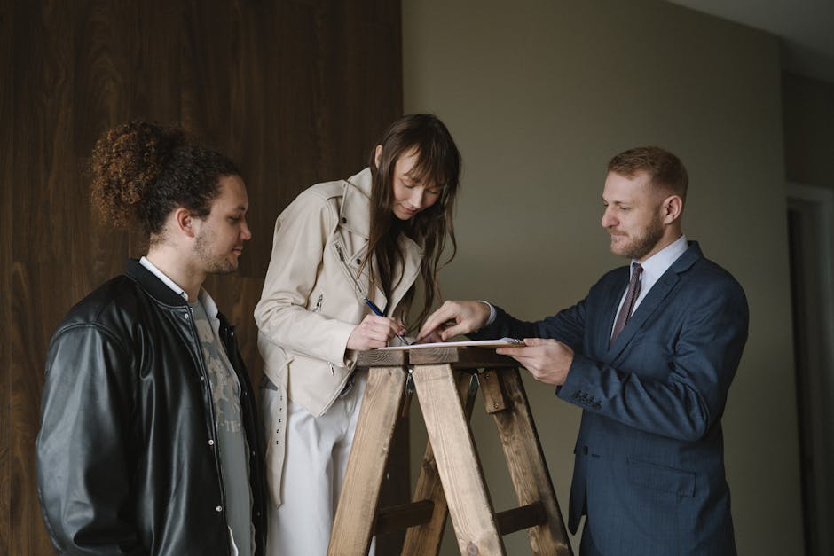 Probate attorney consultation: a calm professional office with two people seated across a wooden desk reviewing a will, asset inventory worksheets, and account statements together, the kind of measured first meeting where a probate attorney walks a surviving family member through the realistic state probate timeline, the inventory and creditor-notice steps, and the documents needed before any retainer is signed on a typical U.S. estate