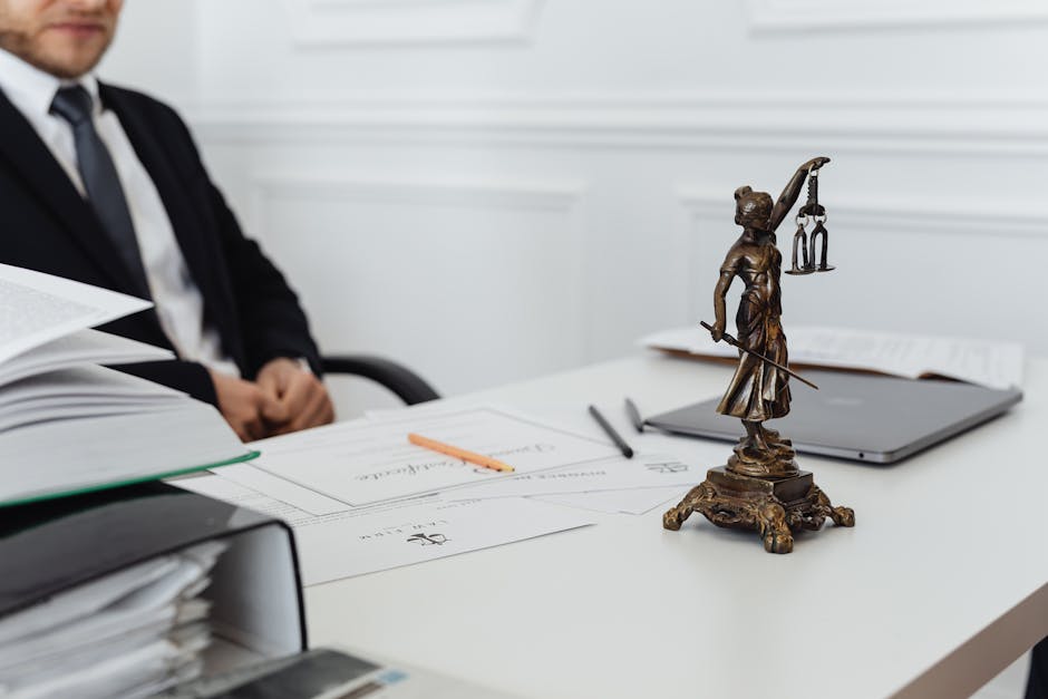 Truck accident attorney consultation: a calm professional office setting with a desk, legal documents, and two people across from each other reviewing a folder, the kind of measured first meeting where a truck accident attorney walks an injured person through the realistic claim timeline, the federal motor-carrier evidence preservation steps, and the documentation that will anchor a commercial-vehicle injury case before any retainer is signed