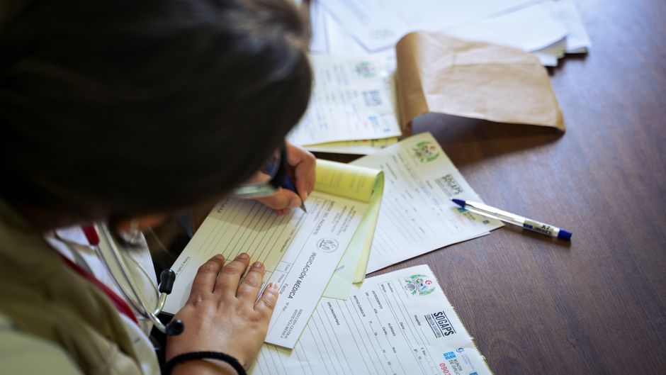 Medical records and documents on a desk that a medical malpractice lawyer reviews to evaluate a claim