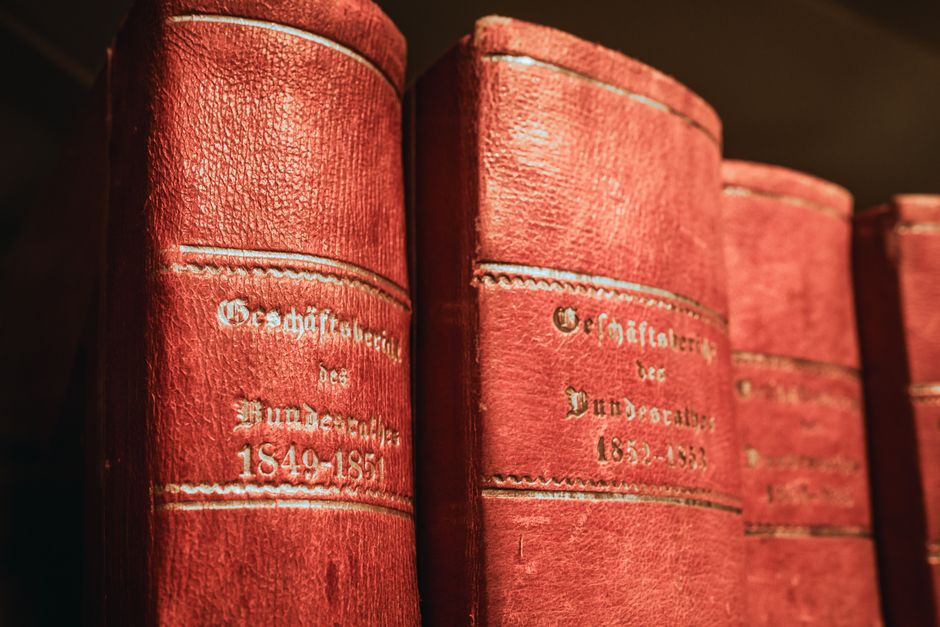 Leather-bound law books and estate documents on a desk illustrating the probate process explained for families