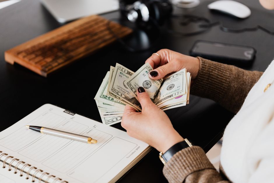 Person reviewing a paycheck affected by wage garnishment laws