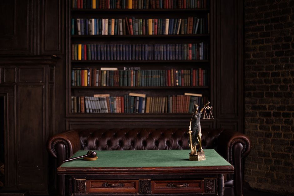 Wrongful death lawyer reviewing case documents in an office