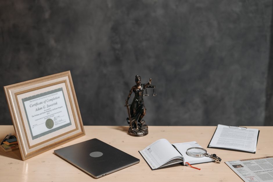 Claim paperwork and legal documents organized on a desk, the records reviewed after a workers comp claim denied notice arrives